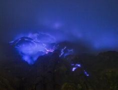 Burning sulfur at the bottom of a crater