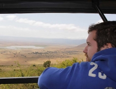 Tom is watching the way to the crater